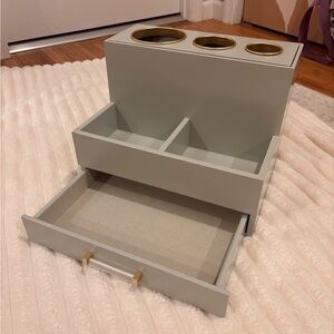 Gray hair tool organizer with gold accents
